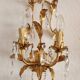 Hand-forged wall lamp gilded with gold leaf and crystals, Italy