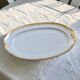 Very large oval dish with gold trim in Limoges porcelain by Peconnet.