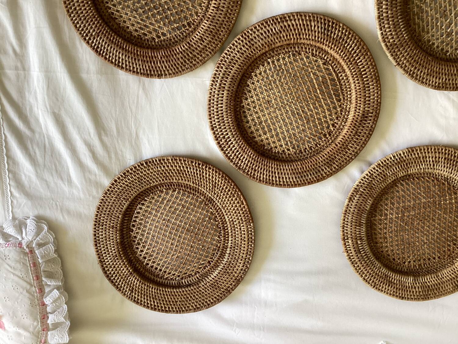 Set of round woven rattan and canework coasters