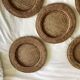 Set of round woven rattan and canework coasters