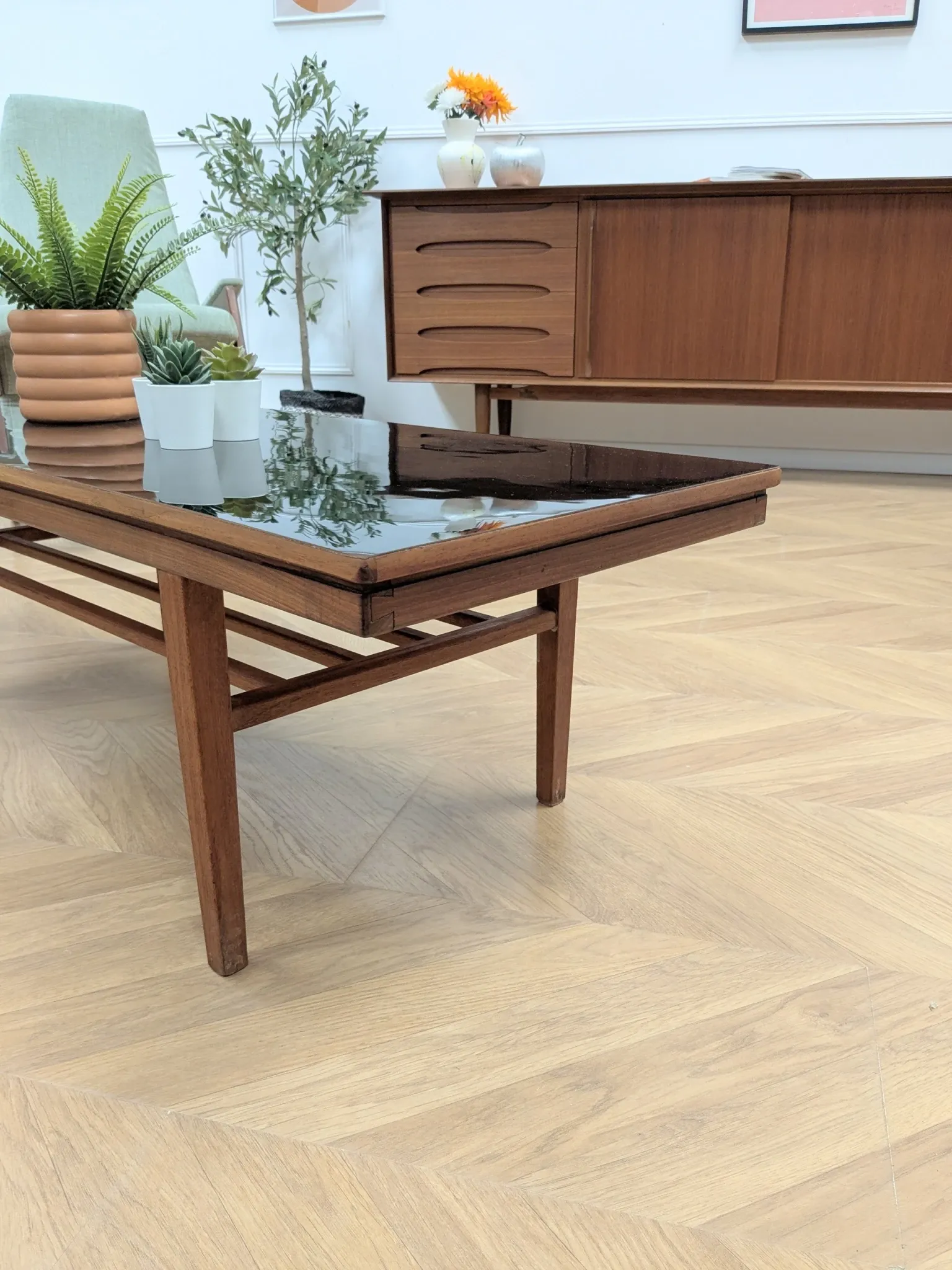 Vintage Danish coffee table in teak with a black top from the 1960s.