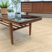 Vintage Danish coffee table in teak with a black top from the 1960s.