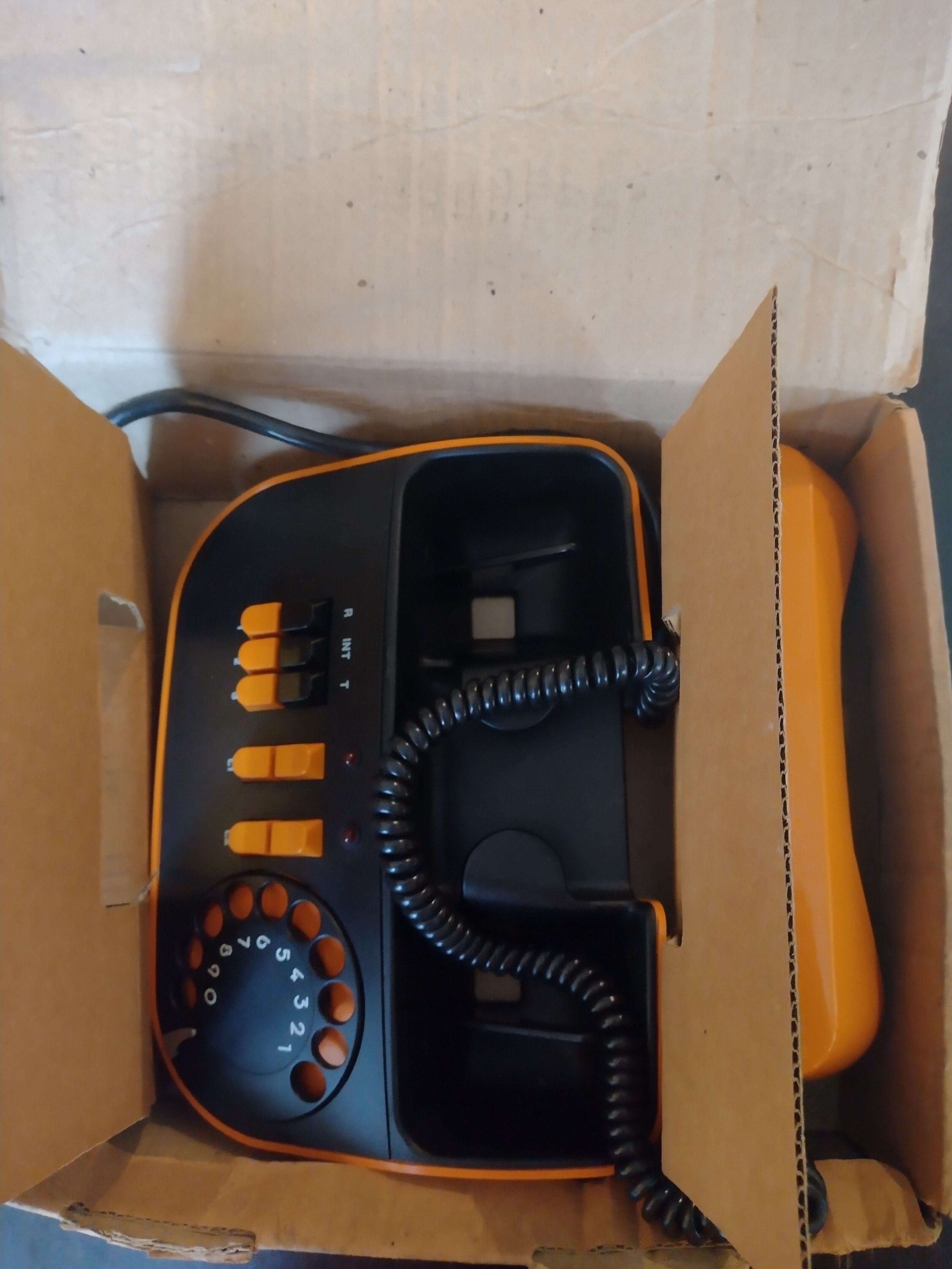 Vintage orange telic phone with ptt dial