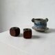 Pair of 1960s teak and brass "dice" candlesticks
