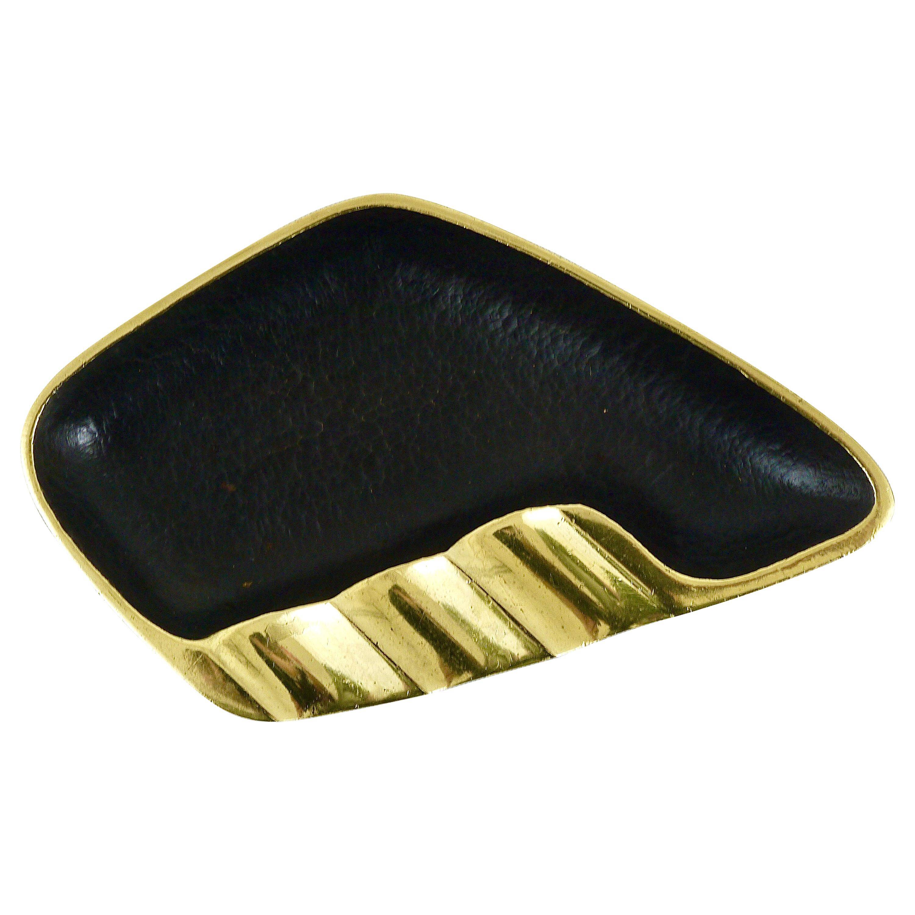 Asymmetrical modernist ashtray by Walter Bosse in black brass by Herta Baller, 1950s.