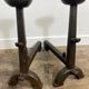 Pair of antique cast iron fire dogs, rustic decor, around 1900.