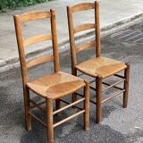 2 solid wood chairs in dark oak and high elephant straw