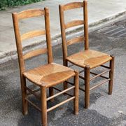 2 solid wood chairs in dark oak and high elephant straw