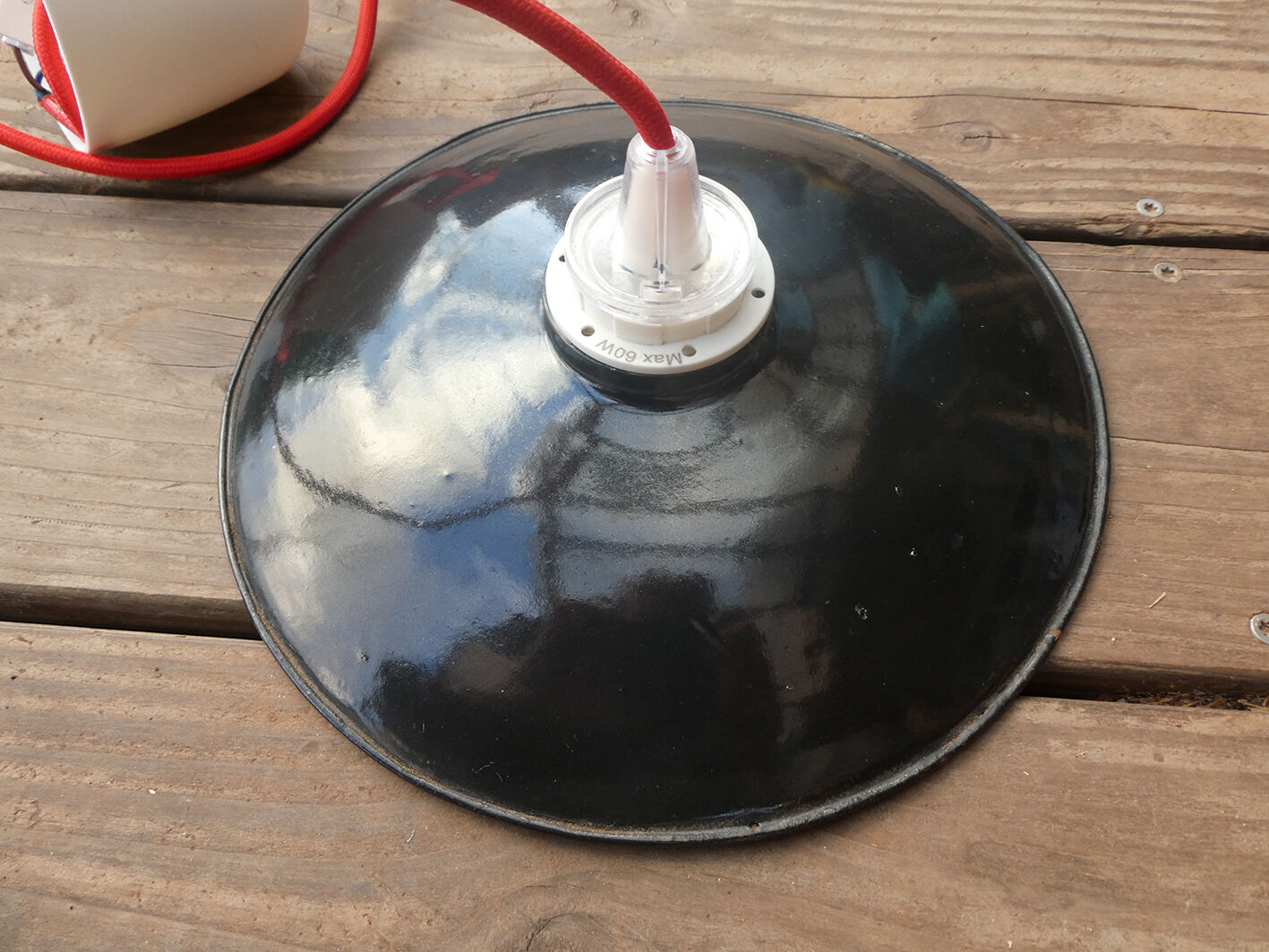 Black hanging lamp in enamelled sheet metal