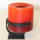 1970 wrought iron candlestick with its period coloured candle.