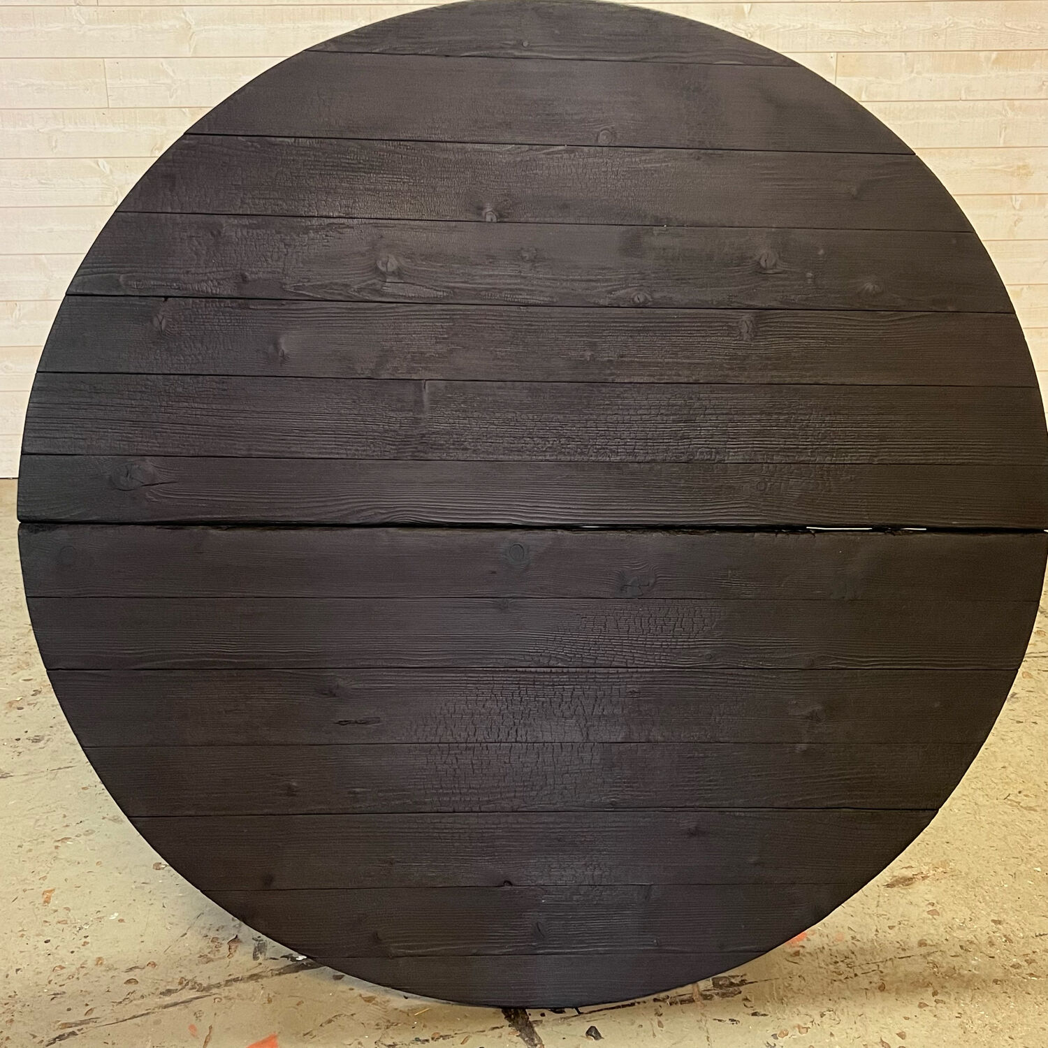 Brutalist round table in burnt wood yakisugi