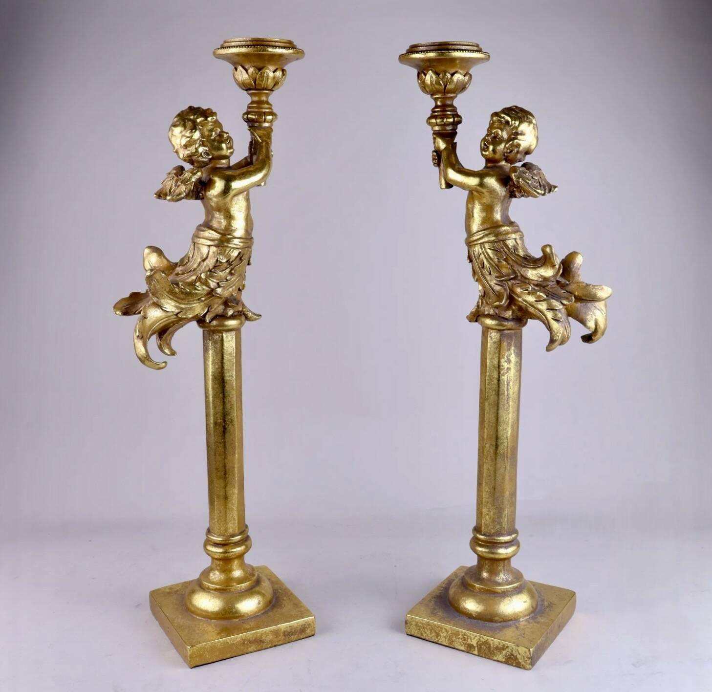 Pair of large candlesticks with cherubs