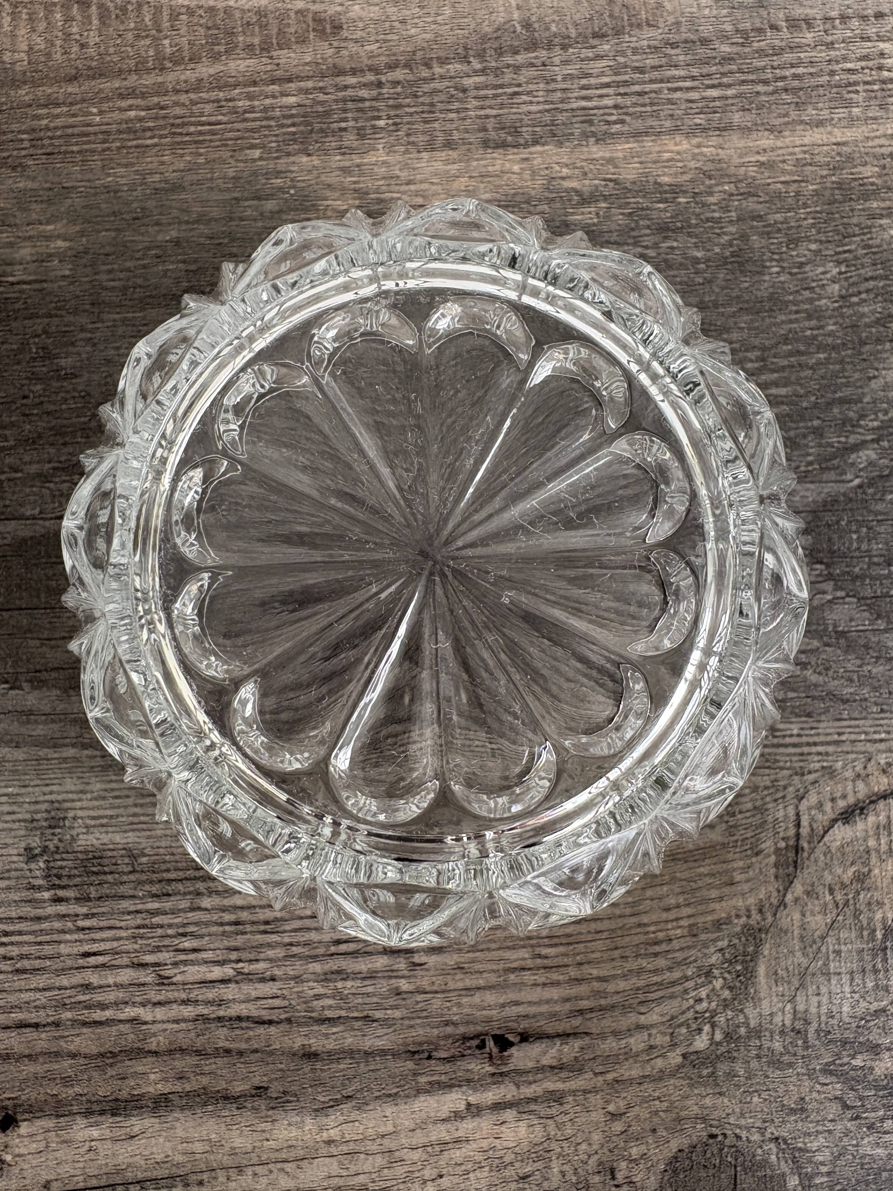 Antique covered jar in chiseled glass