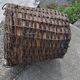 Brown woven vintage Hungarian wicker basket, reinforced edge and metal handles, 1940s.