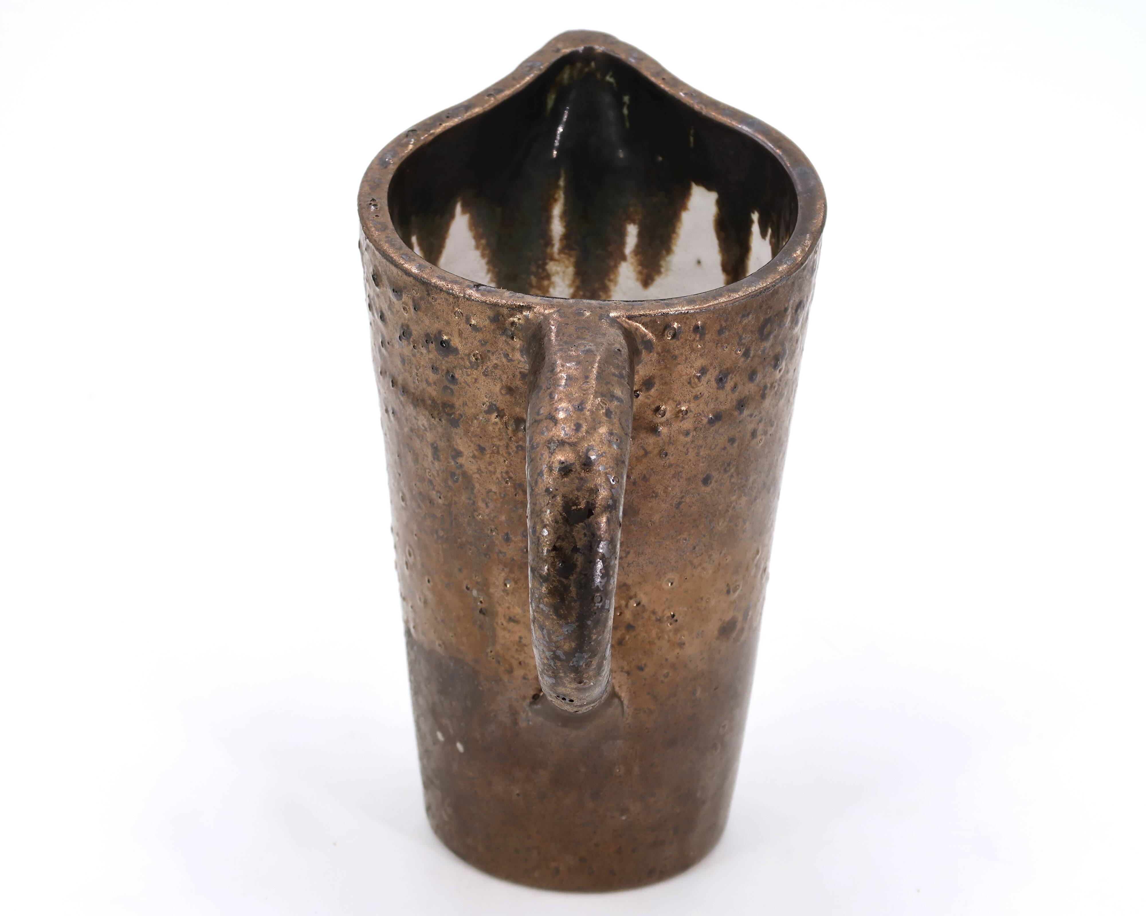 Golden ceramic pitcher, 1950s