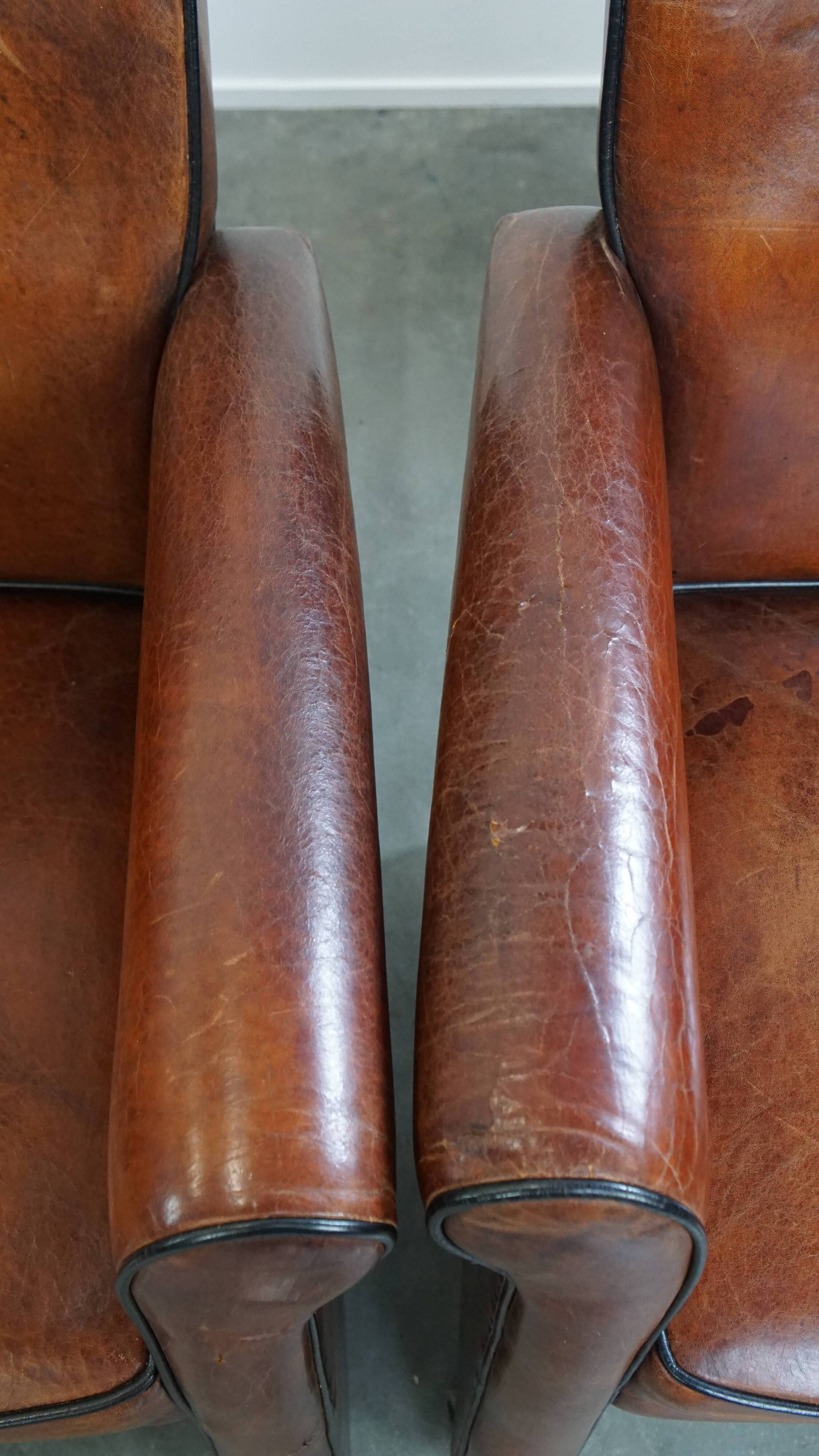 Vintage set of 4 sheepskin leather dining chairs on castors