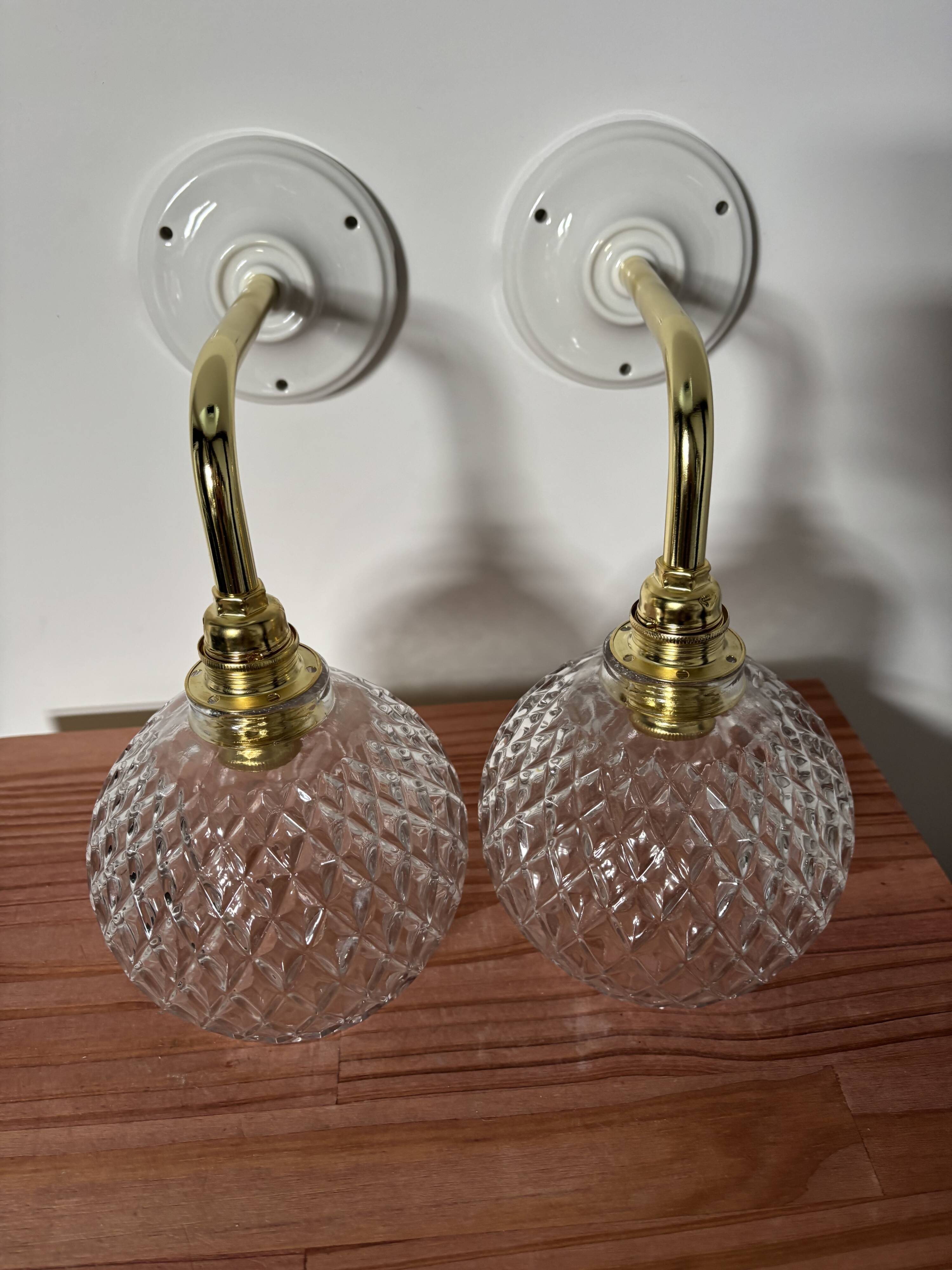 Pair of chiseled glass globe wall sconces
