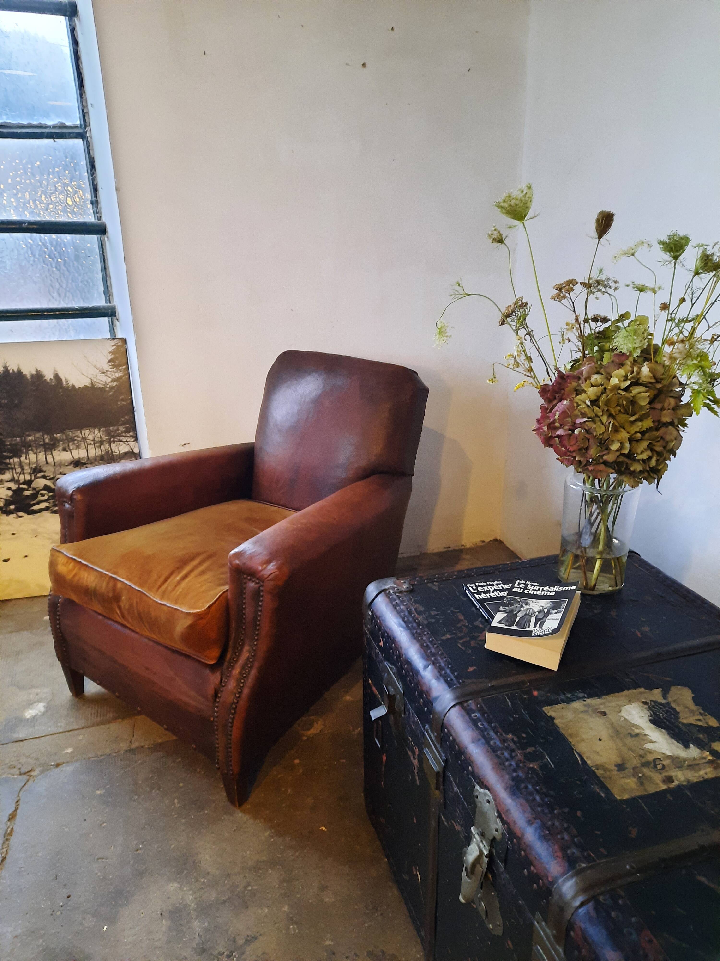 Old studded leather club chair 1930-1930
