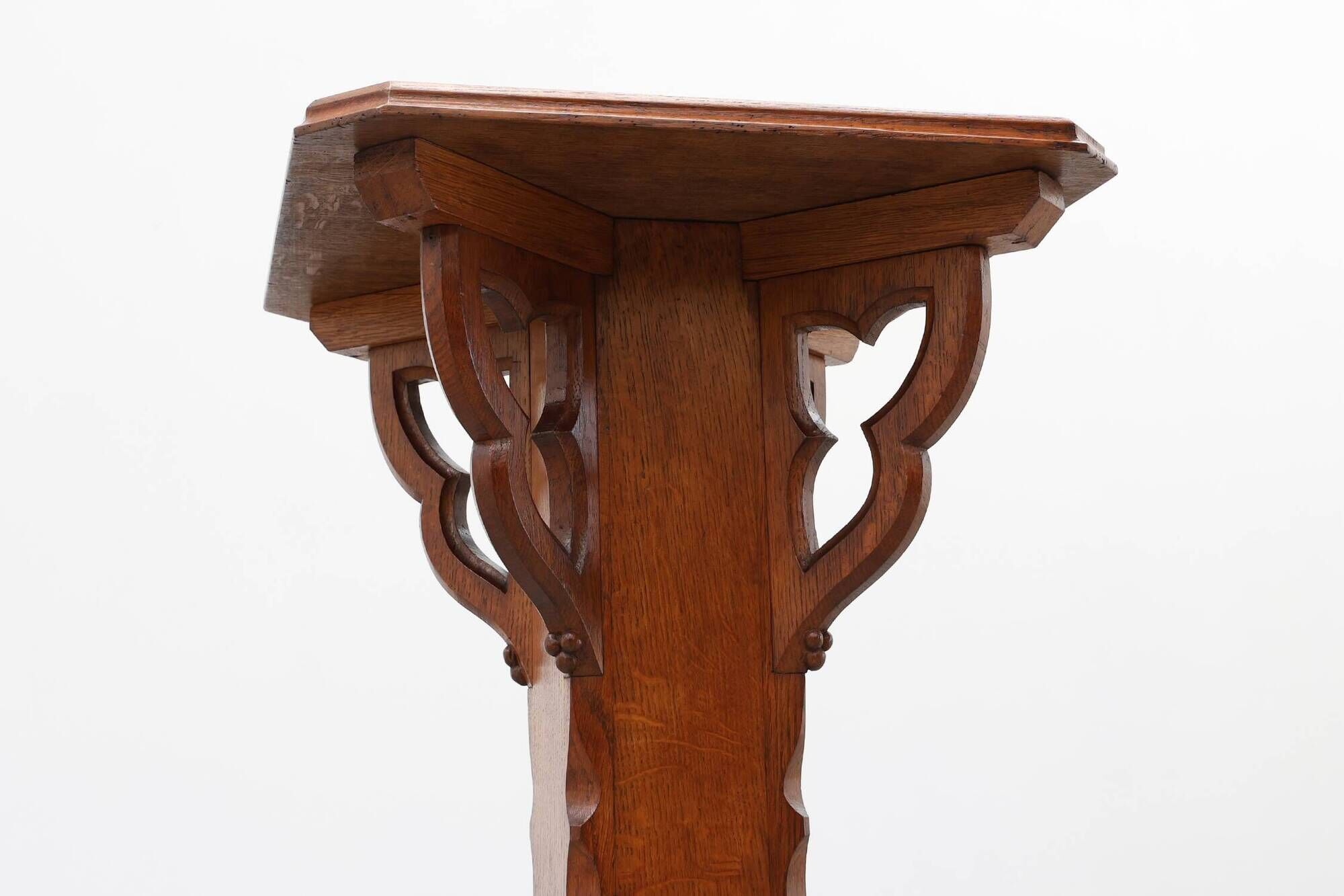 Art Deco oak pedestal with pierced brackets and cross base, Belgium 1920s