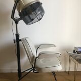 Vintage hairdresser's armchair with helmet transformed into a lamp