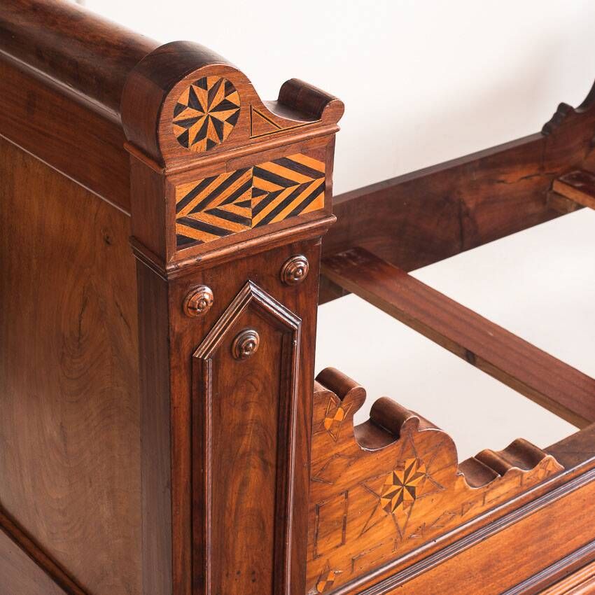 Bed made of solid walnut with marquetry details. France, 1930s.