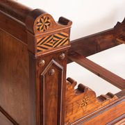 Bed made of solid walnut with marquetry details. France, 1930s.