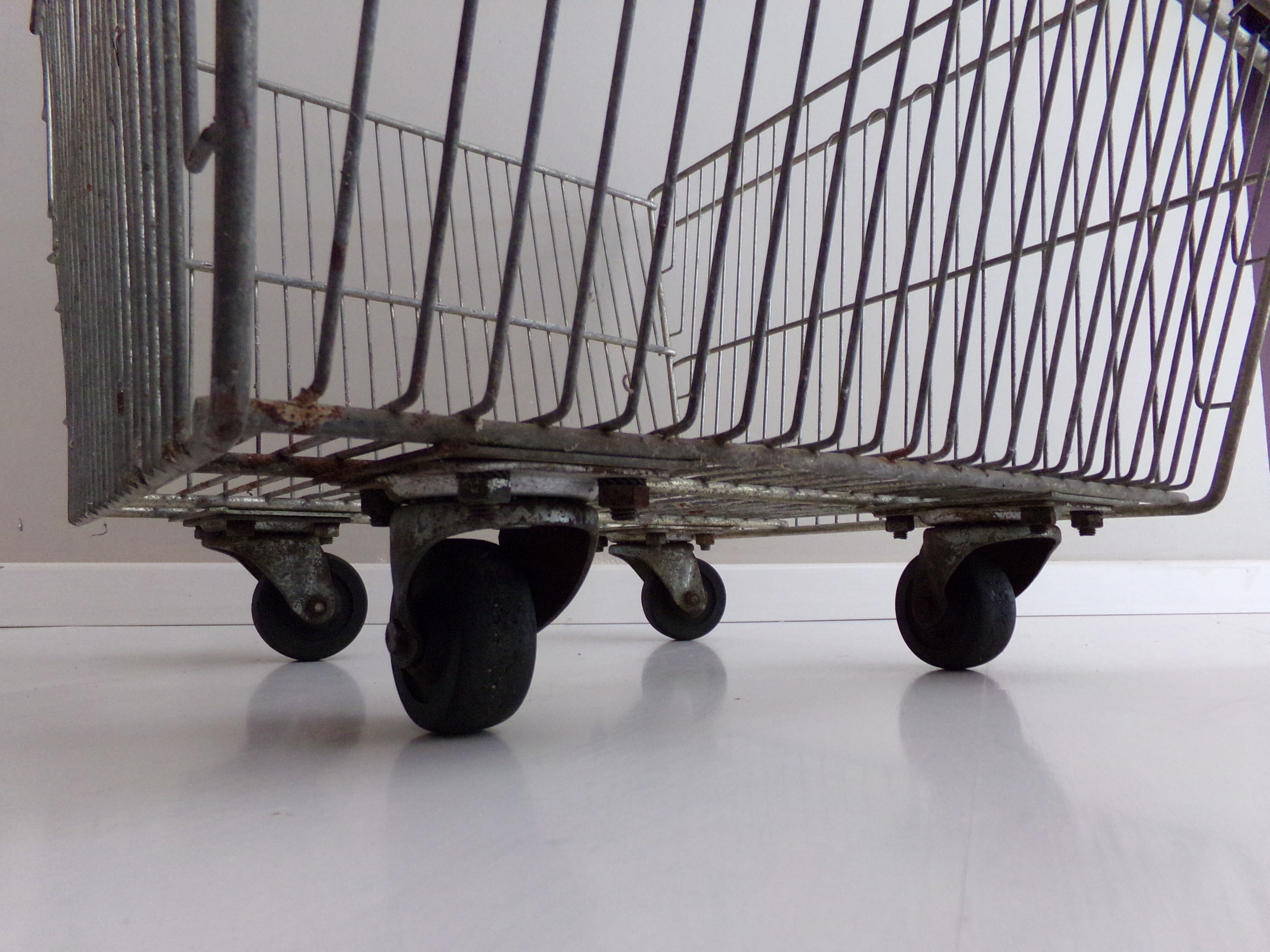 Metal grocery shelf on wheels