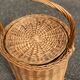 Round woven rattan and wicker umbrella holder with handle
