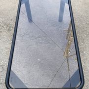 Vintage black tubular coffee table with smoked glass by Yves Boutboul, 1980.