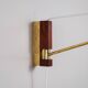 Suspendable wall lamp with brass and wood details