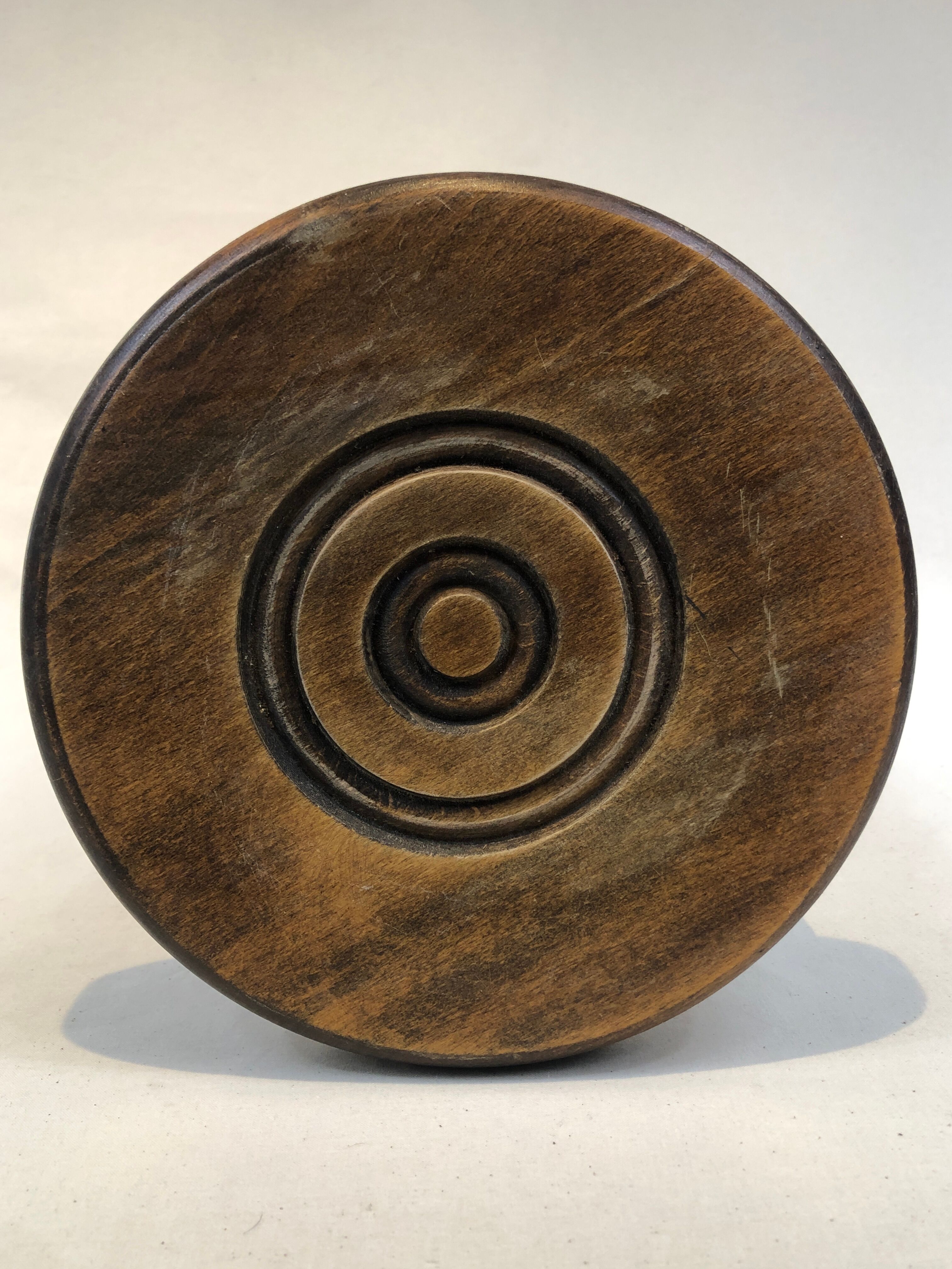 Dark turned wood tripod stool