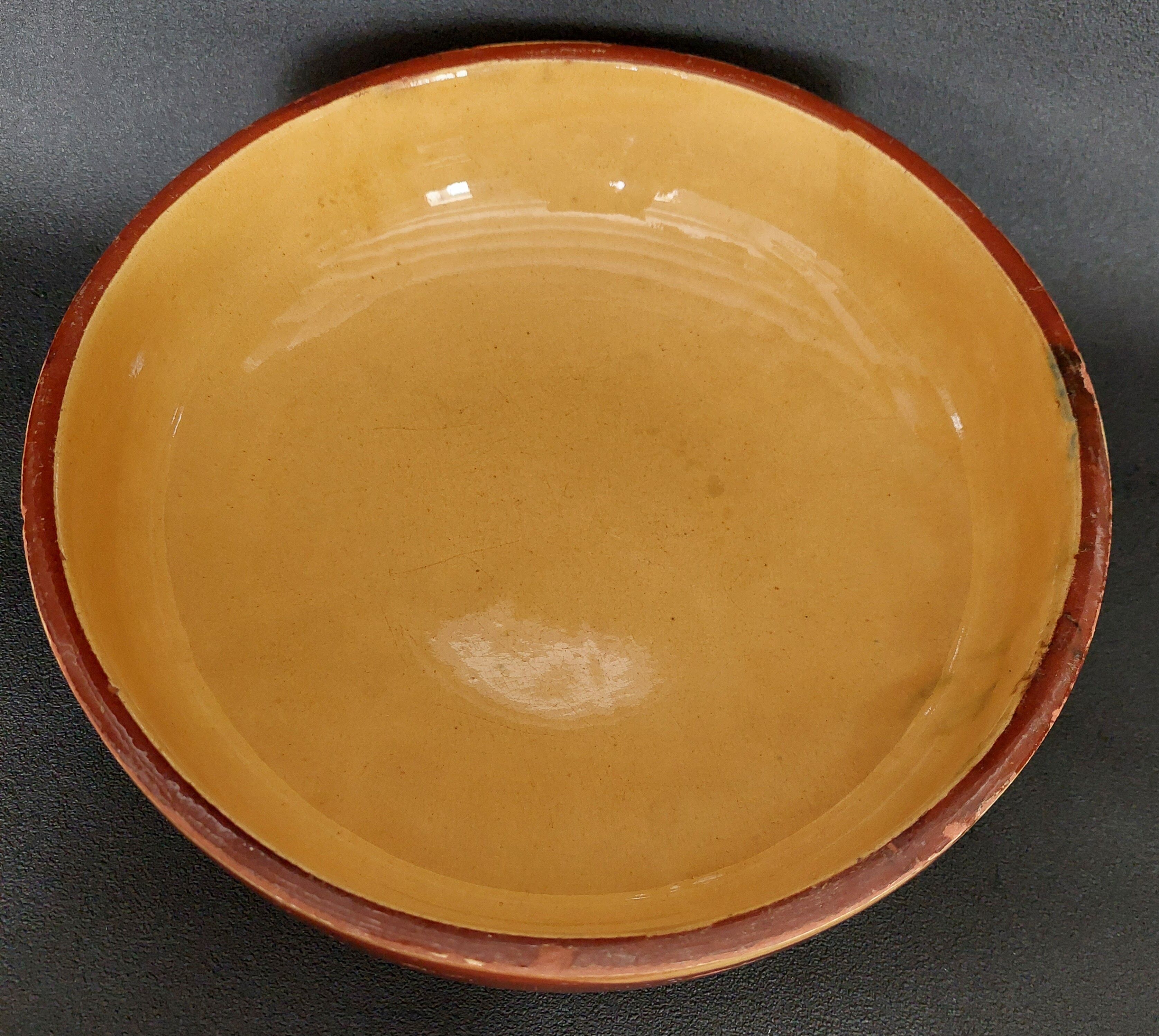 Glazed terracotta shallow dish from the 20th century.