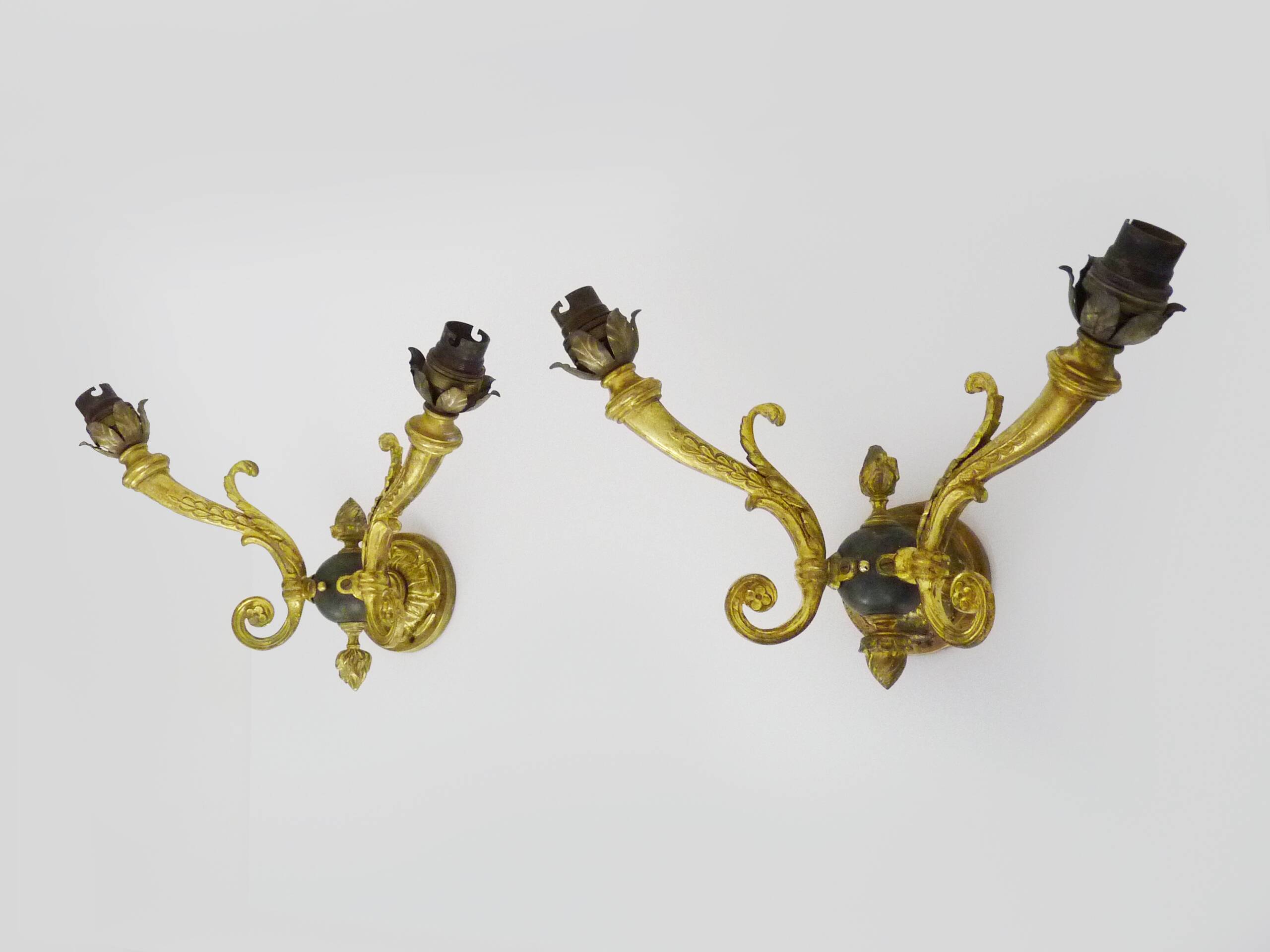 Pair of double-light Empire style wall lights in bronze