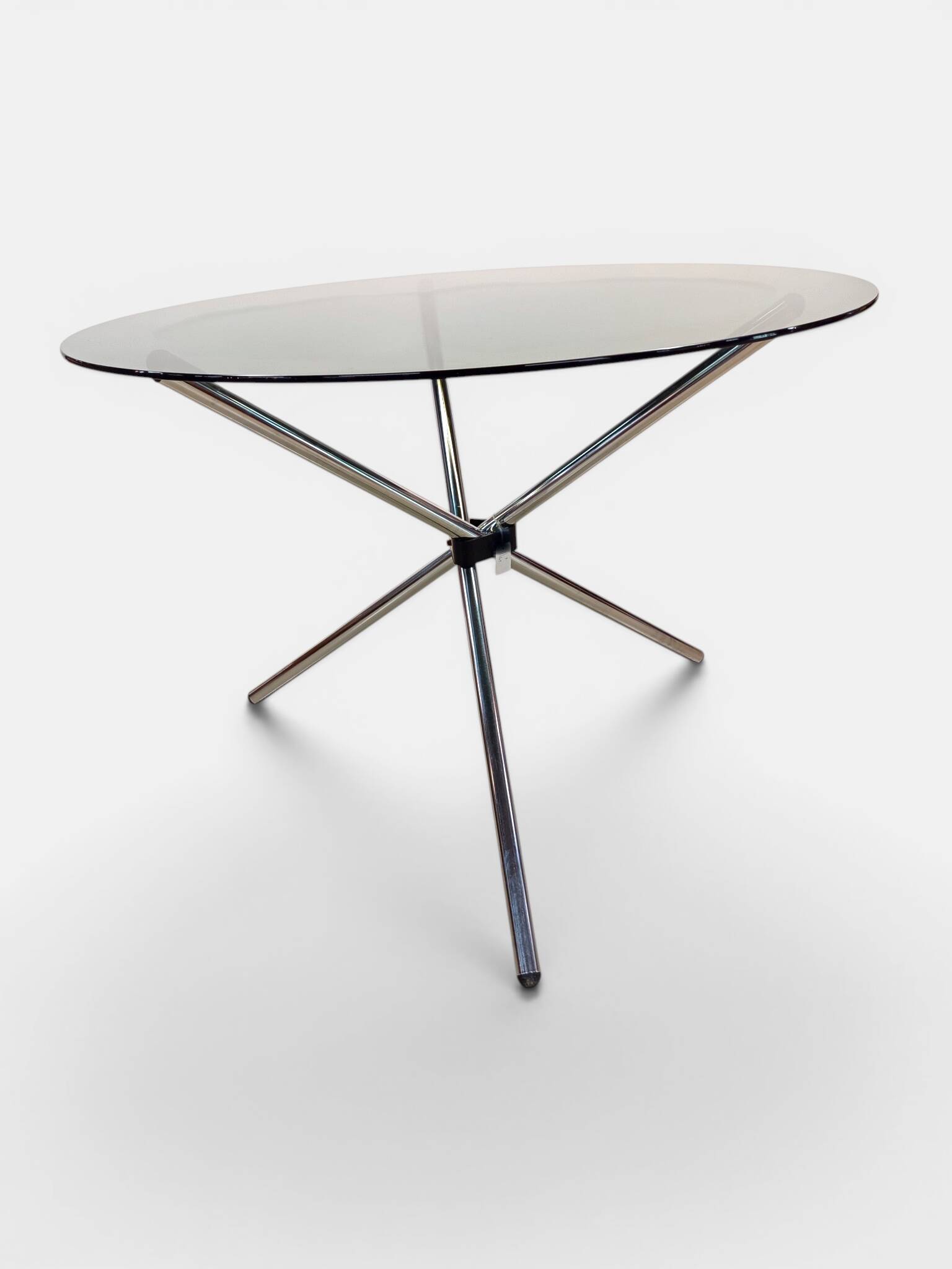 Vintage round table with smoked glass and foldable chrome legs.