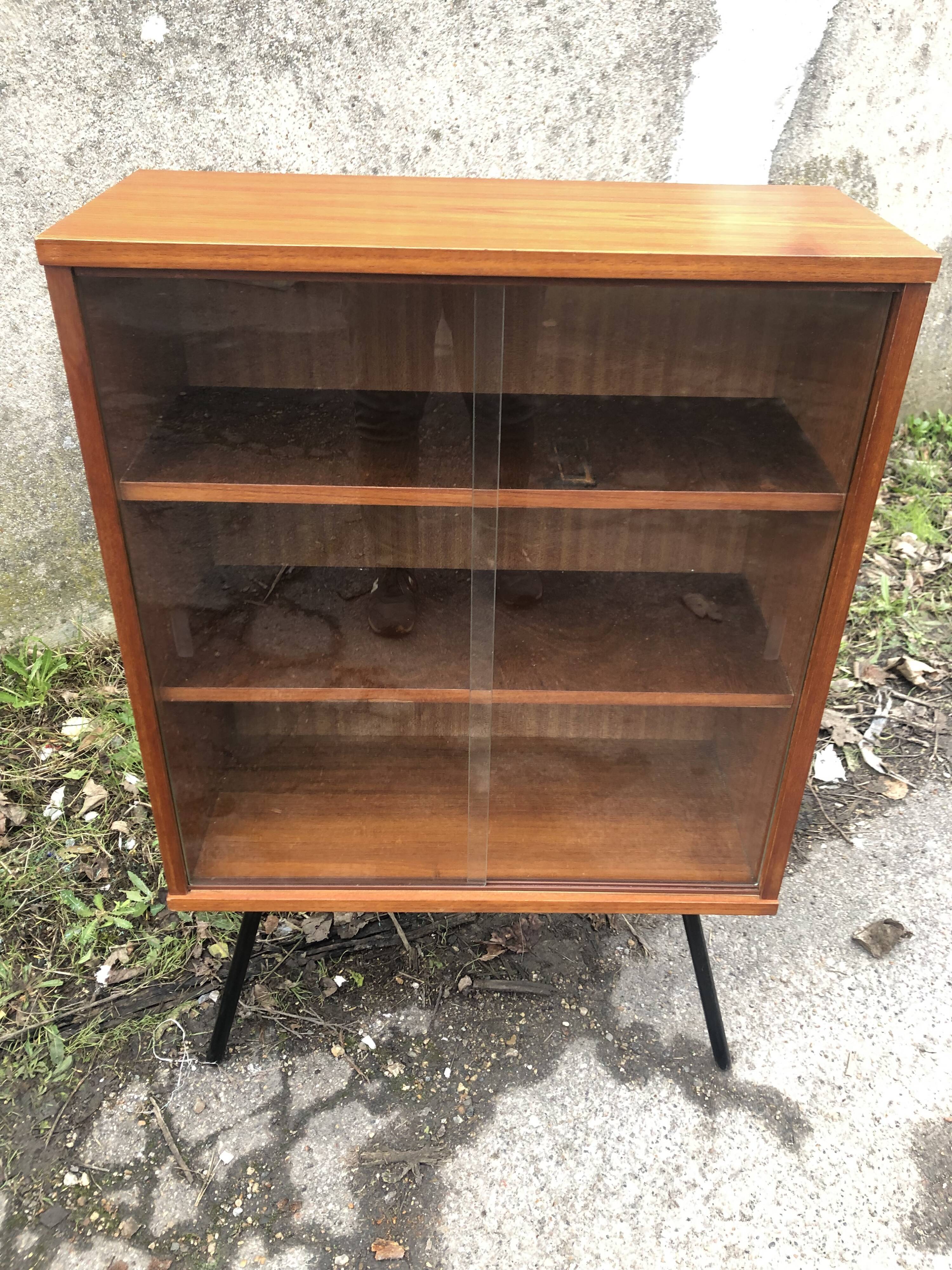 Library showcase with sliding glass doors 60s