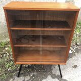 Library showcase with sliding glass doors 60s