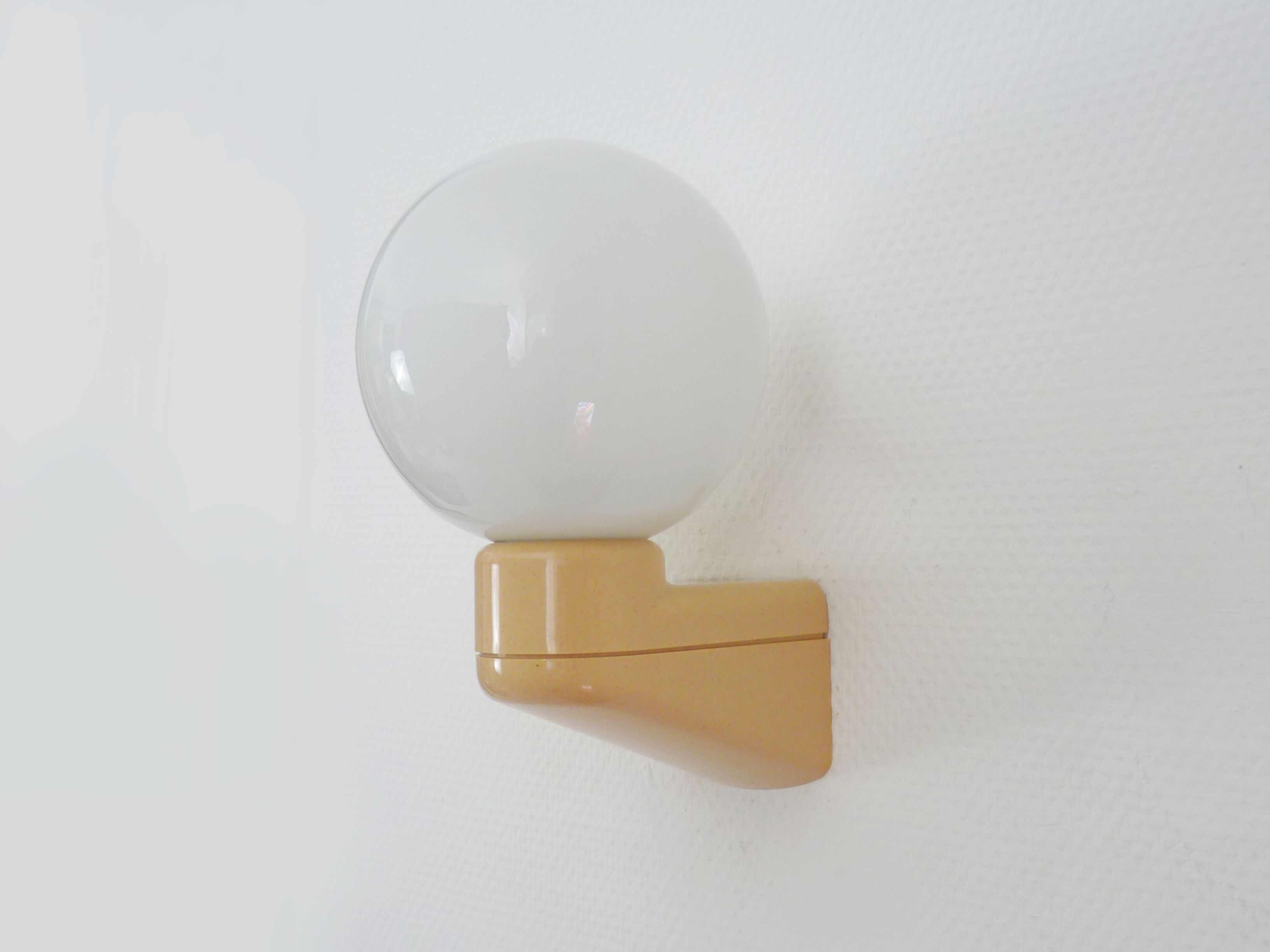 Vintage wall lamp in beige pvc with pink dot and globe in white opaline. Year 70