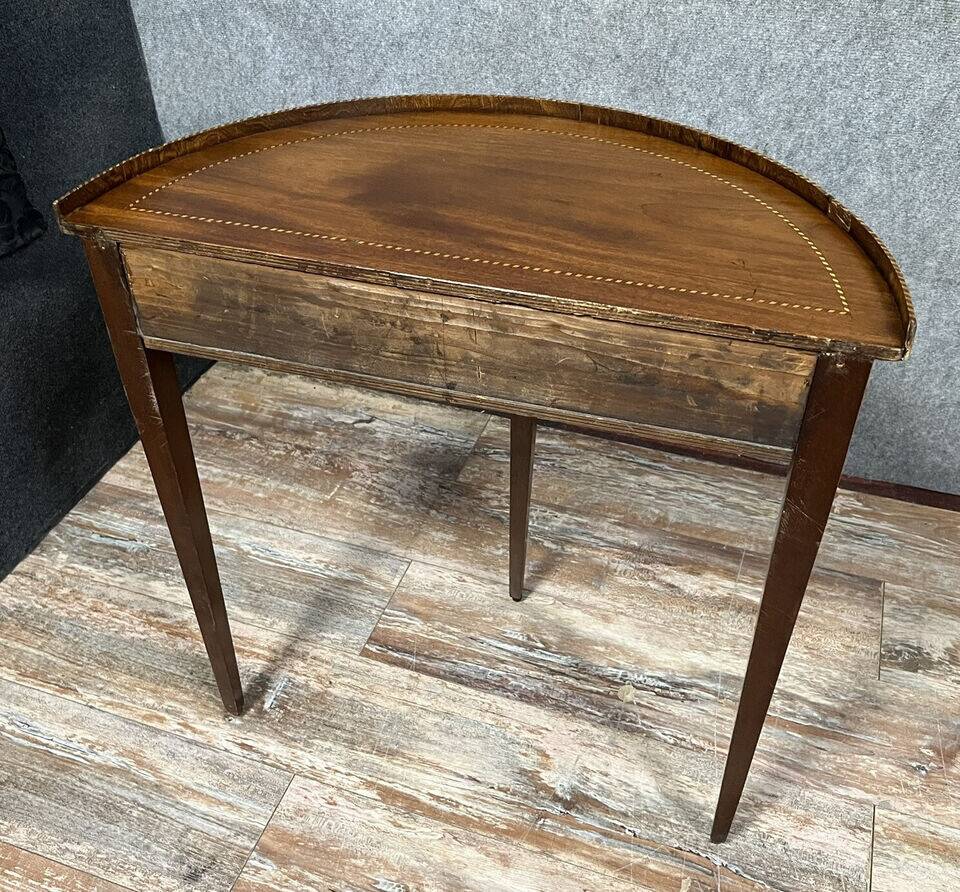 Louis XVI style half-moon console in mahogany and light wood marquetry circa 1850