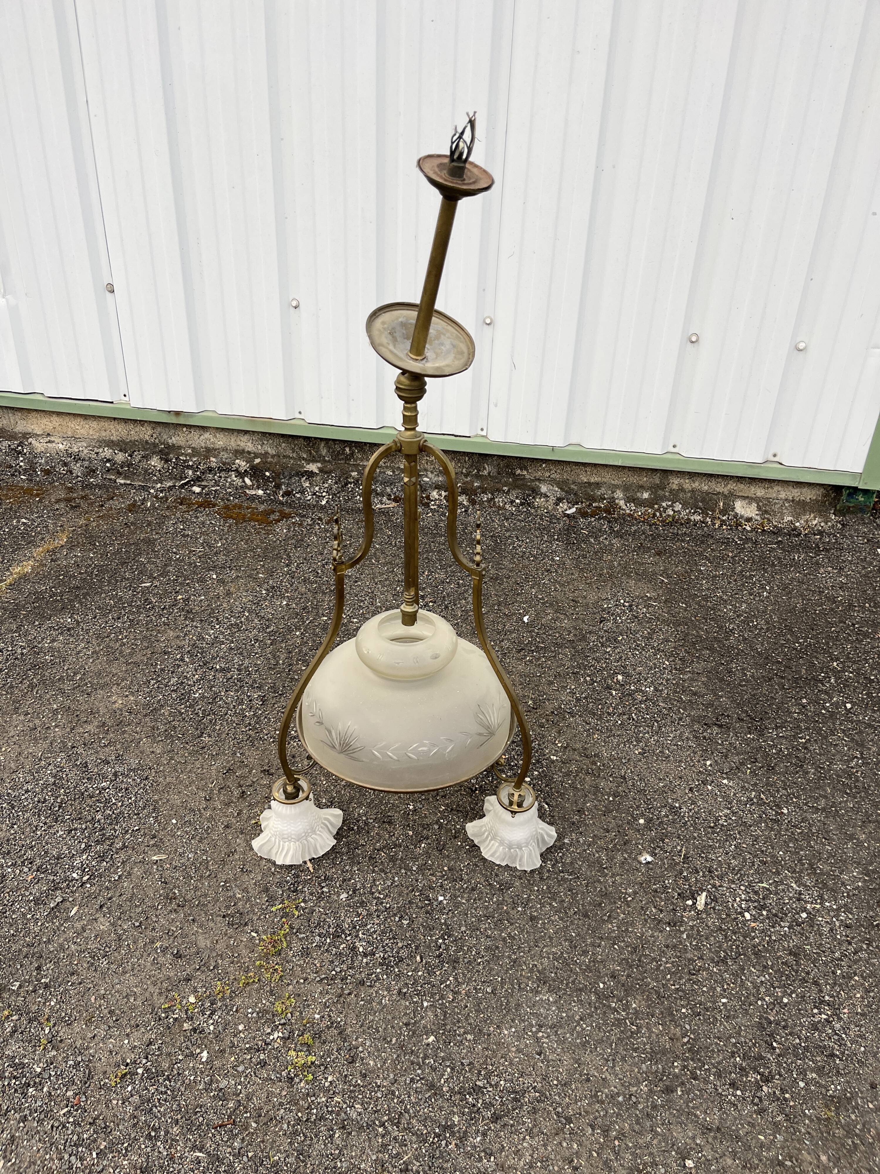 Antique brass chandelier with 3 lights and frosted glass shades.