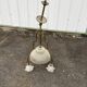 Antique brass chandelier with 3 lights and frosted glass shades.