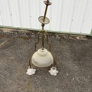 Antique brass chandelier with 3 lights and frosted glass shades.