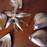 Individual ashtrays on decorative metal flower