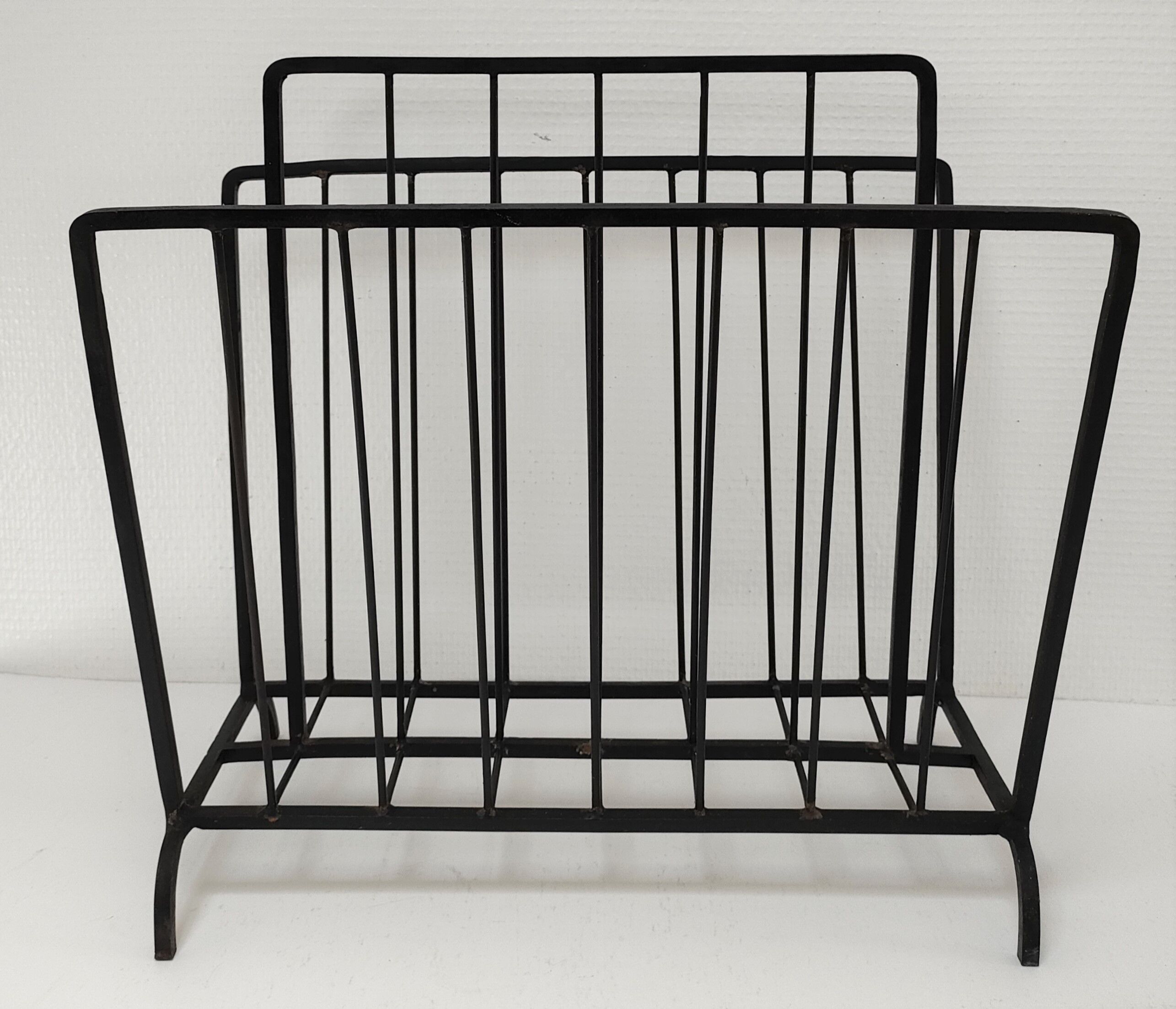 Modernist magazine holder black iron 60s