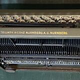 Triumph perfekt typewriter with its transport box.