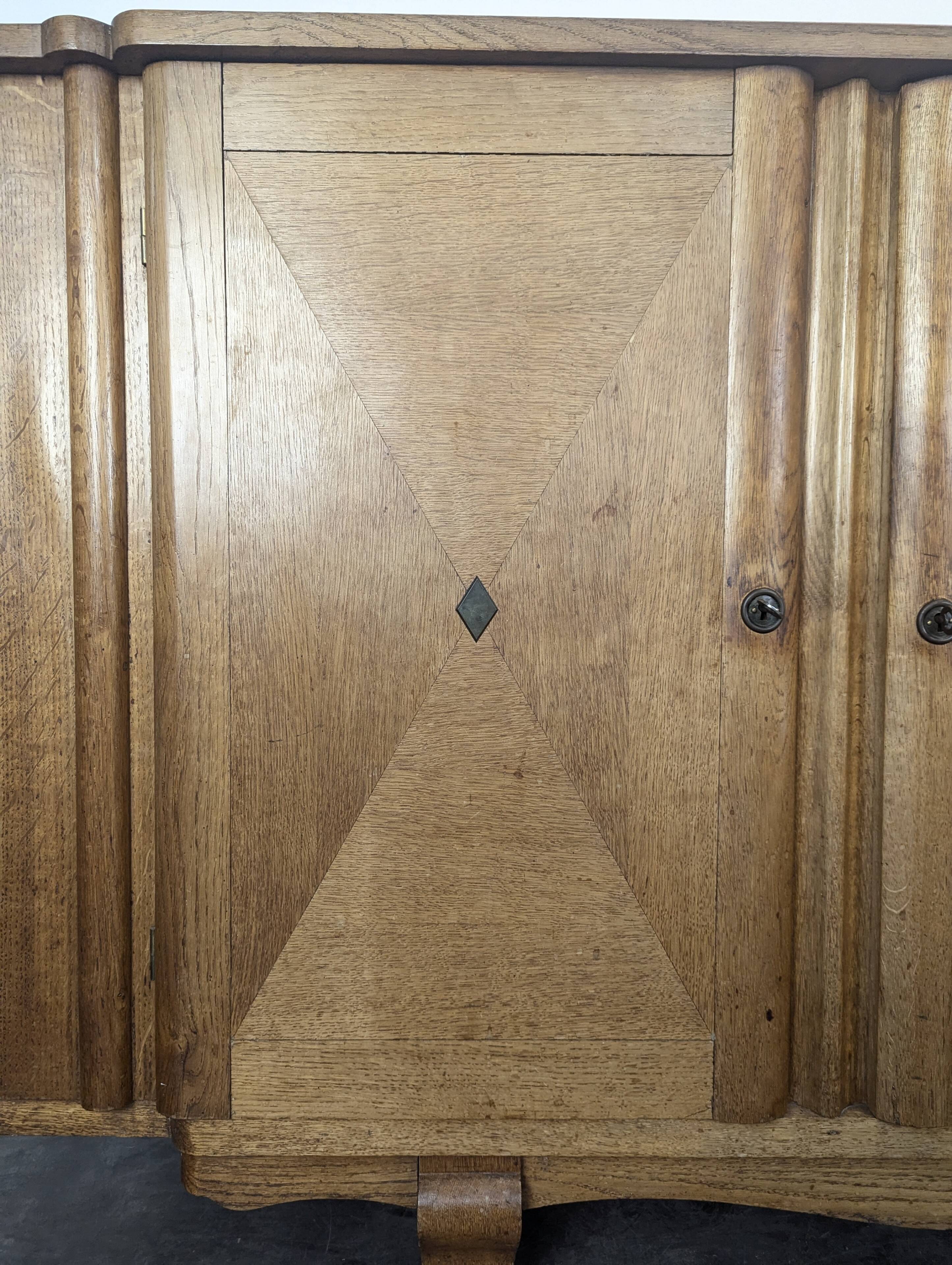 Art Deco oak enfilade with checkerboard marquetry, three doors, 1940s.