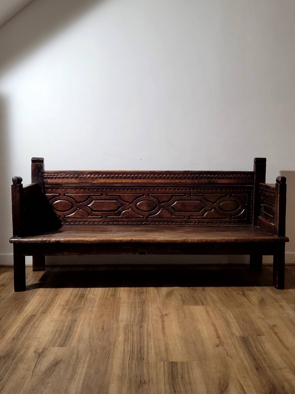 Antique carved solid wood bench from the early 20th century