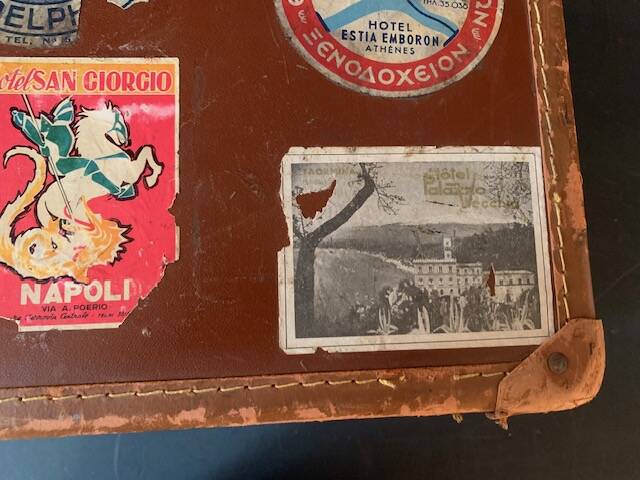 Old travel suitcase and legendary stickers, 1920