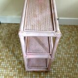 Pink rattan and cane shelf