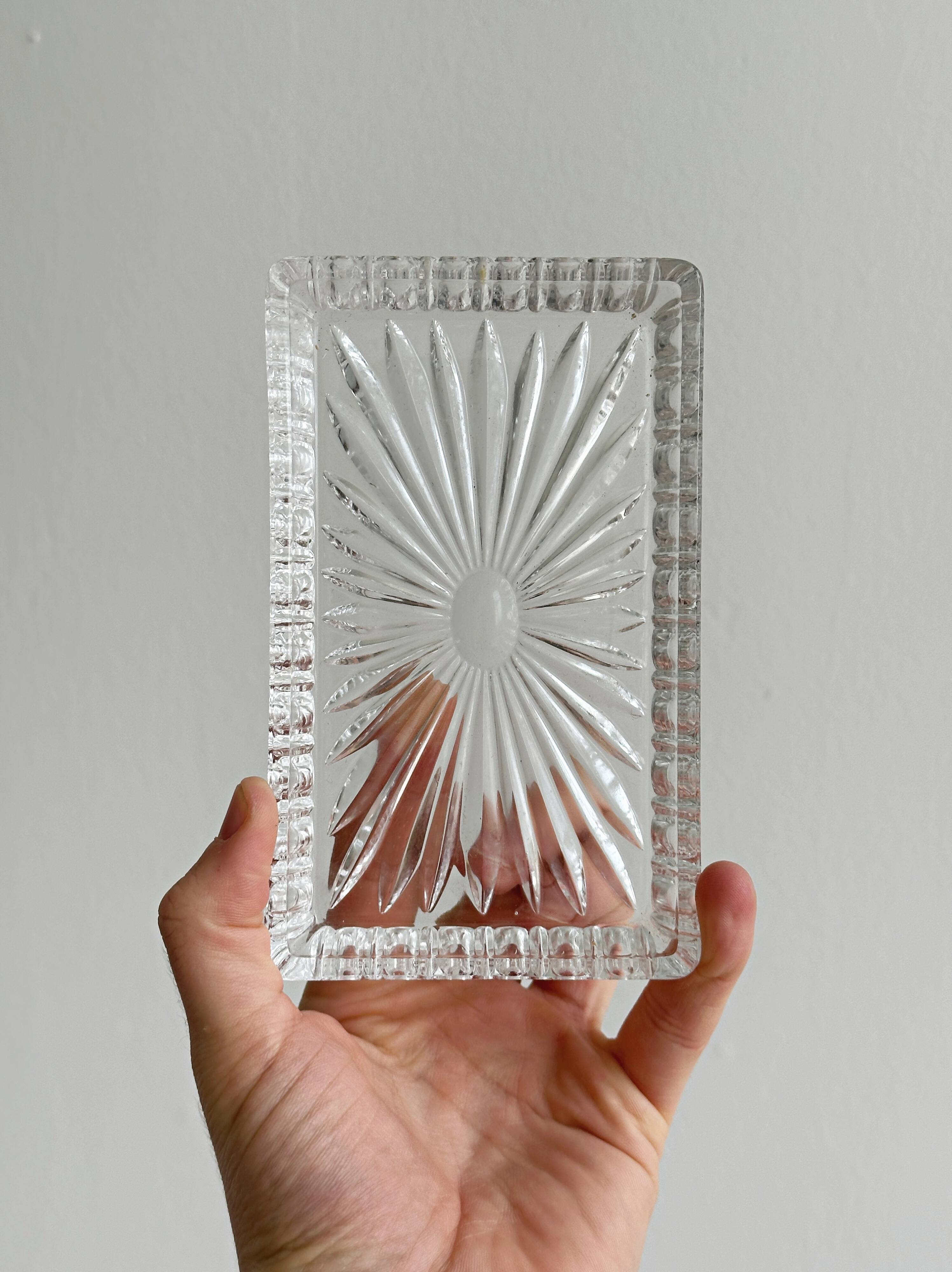 Metal butter dish and thick rectangular glass bowl.