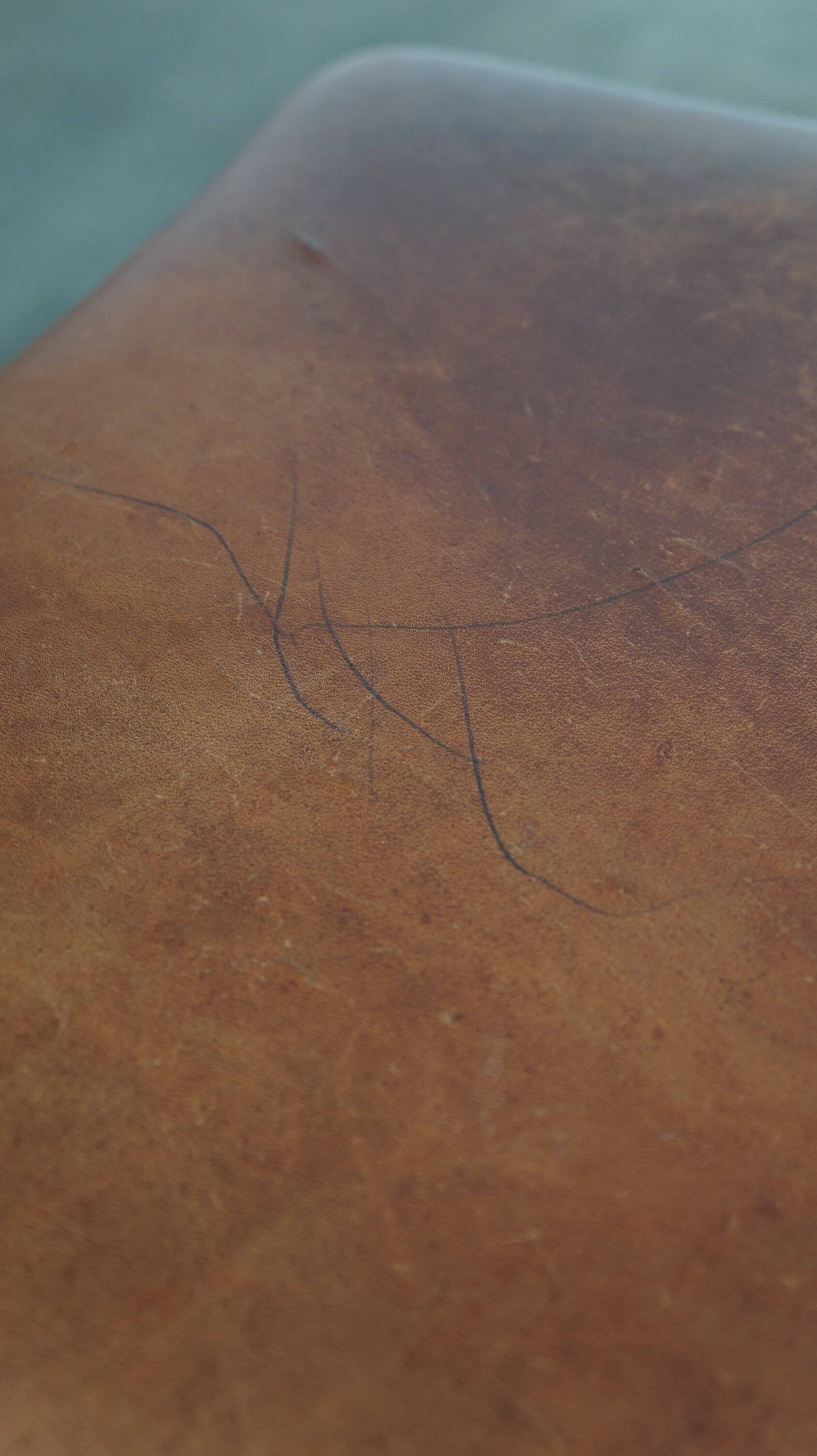 Leather ottoman in classic English style finished with decorative nails